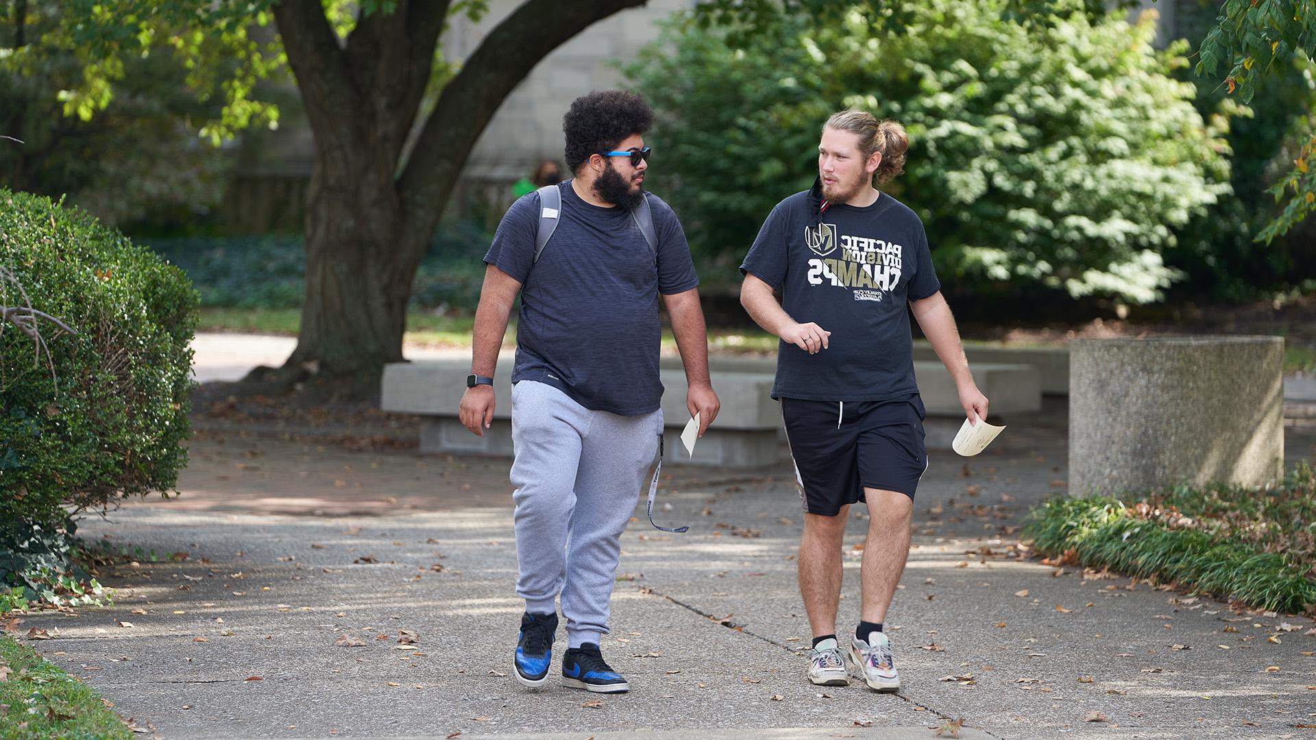 Two male students walking together