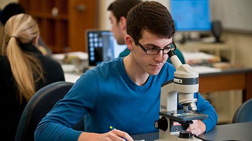 Student with microscope