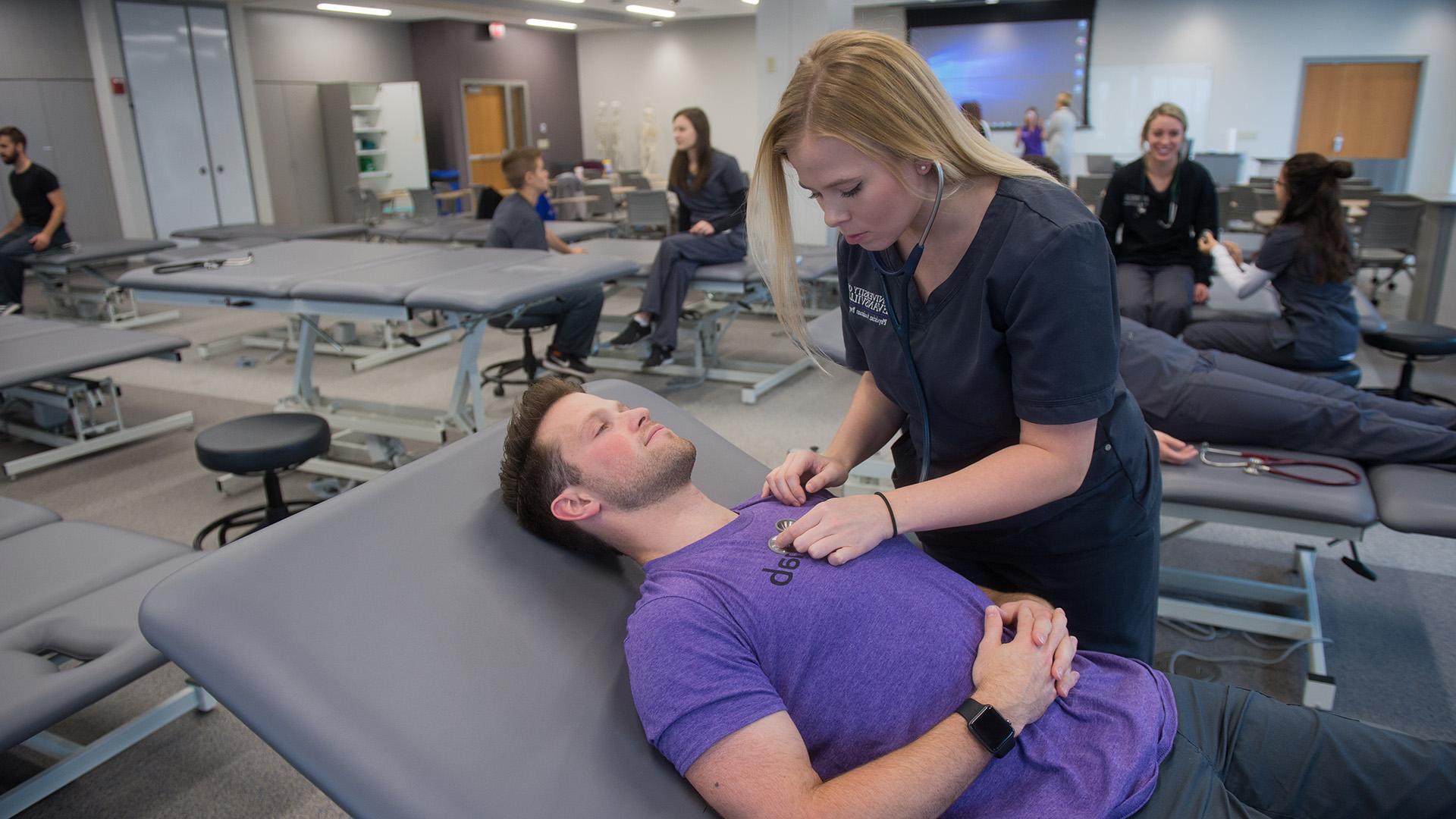 Student with patient reclined