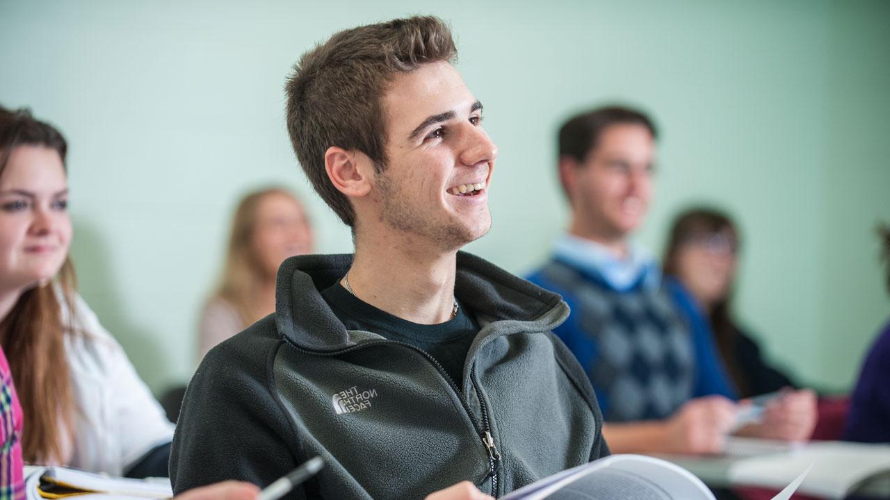 Smiling student in class